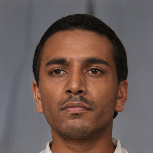 Neutral latino young-adult male with short  brown hair and brown eyes