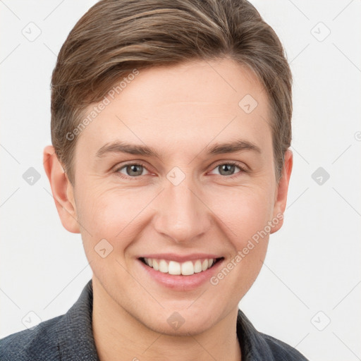 Joyful white young-adult male with short  brown hair and grey eyes