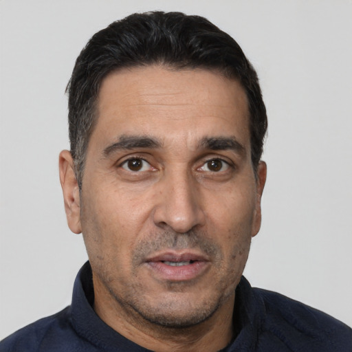Neutral white adult male with short  black hair and brown eyes
