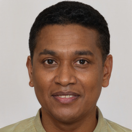 Joyful latino adult male with short  black hair and brown eyes
