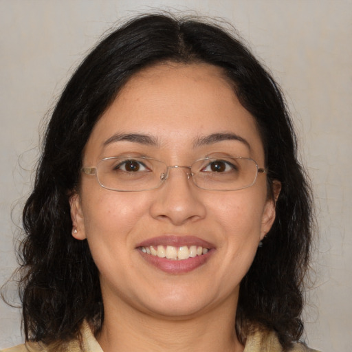 Joyful white adult female with medium  brown hair and brown eyes