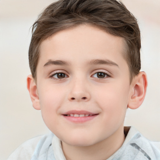 Joyful white child male with short  brown hair and brown eyes