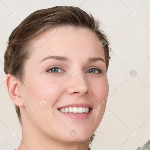 Joyful white young-adult female with short  brown hair and grey eyes