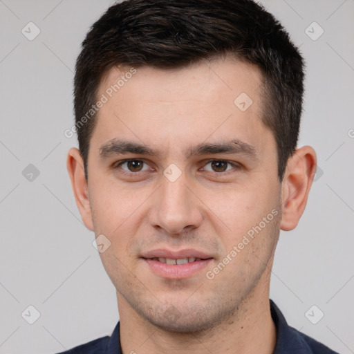 Joyful white young-adult male with short  brown hair and brown eyes