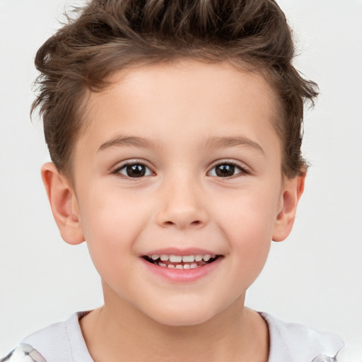 Joyful white child male with short  brown hair and brown eyes