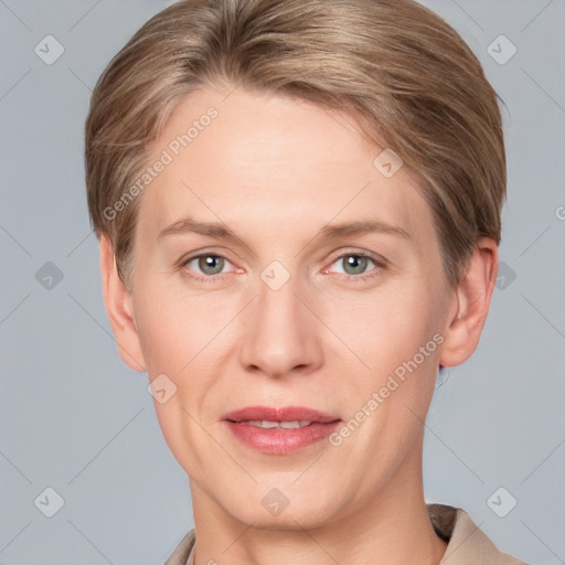 Joyful white adult female with short  brown hair and grey eyes