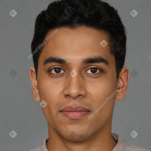 Joyful latino young-adult male with short  black hair and brown eyes