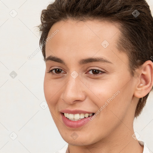 Joyful white young-adult female with short  brown hair and brown eyes