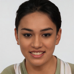 Joyful asian young-adult female with short  brown hair and brown eyes