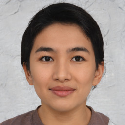 Joyful asian young-adult female with short  black hair and brown eyes