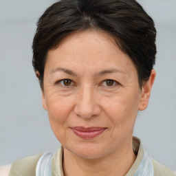 Joyful white adult female with short  brown hair and brown eyes