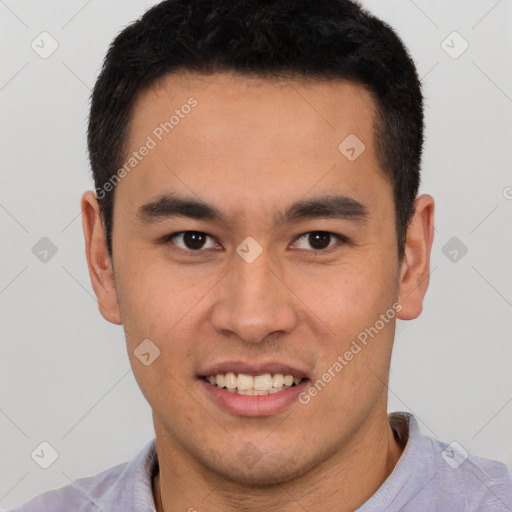 Joyful latino young-adult male with short  brown hair and brown eyes