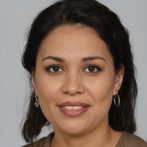 Joyful white adult female with medium  brown hair and brown eyes