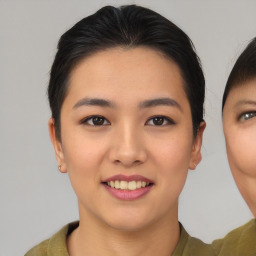 Joyful asian young-adult female with short  brown hair and brown eyes