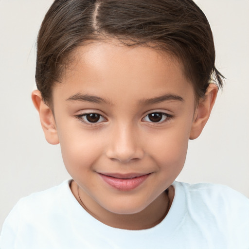 Joyful white child female with short  brown hair and brown eyes