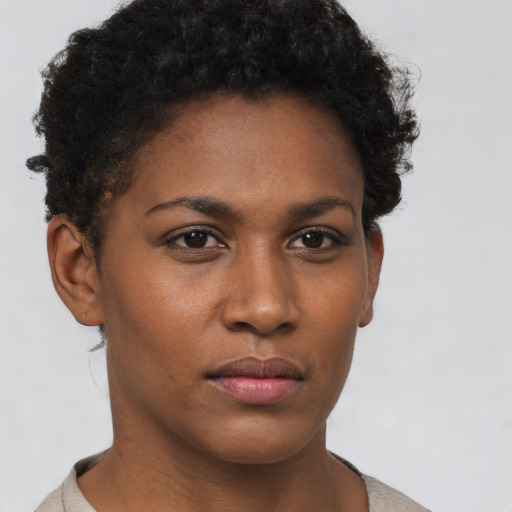 Neutral black young-adult female with short  brown hair and brown eyes