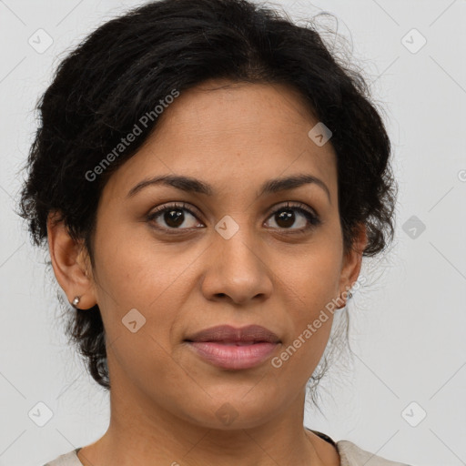 Joyful latino adult female with medium  brown hair and brown eyes