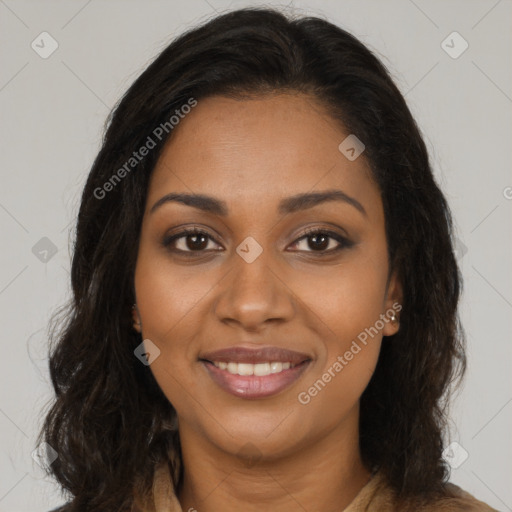 Joyful black young-adult female with long  brown hair and brown eyes