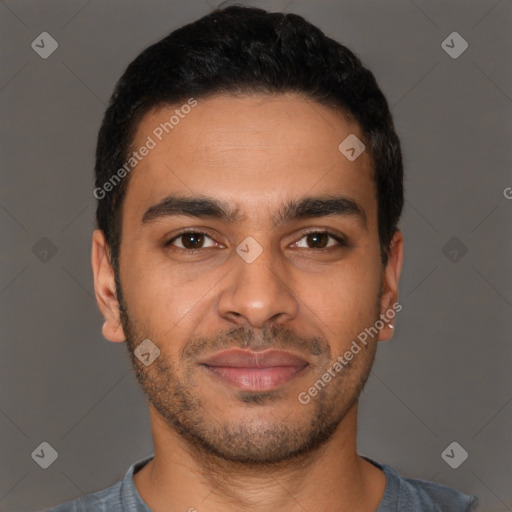 Joyful latino young-adult male with short  brown hair and brown eyes