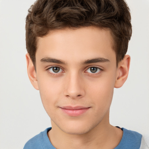 Joyful white child male with short  brown hair and brown eyes