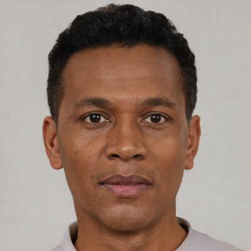 Neutral black adult male with short  black hair and brown eyes