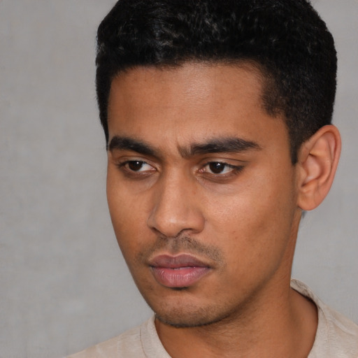 Neutral latino young-adult male with short  black hair and brown eyes