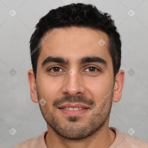 Joyful white young-adult male with short  black hair and brown eyes