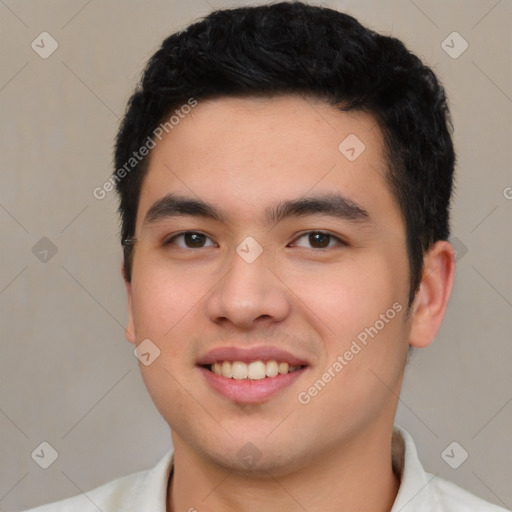 Joyful white young-adult male with short  black hair and brown eyes