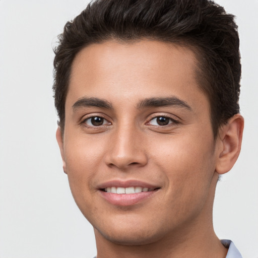 Joyful white young-adult male with short  brown hair and brown eyes