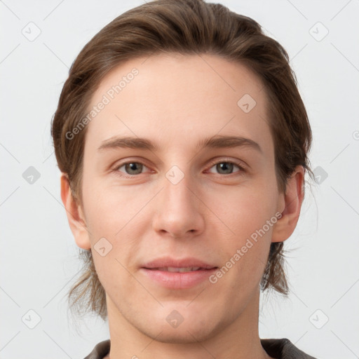 Joyful white young-adult female with short  brown hair and grey eyes