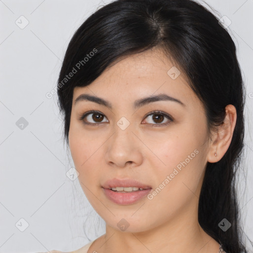 Joyful asian young-adult female with medium  brown hair and brown eyes