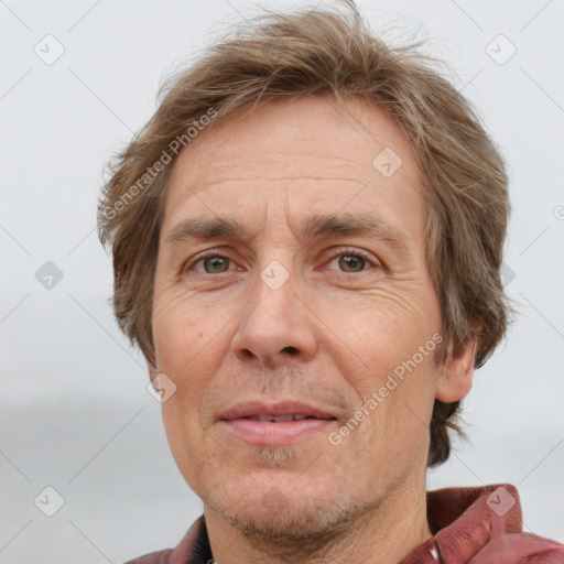 Joyful white adult male with short  brown hair and grey eyes