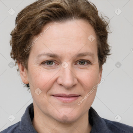 Joyful white adult female with short  brown hair and grey eyes