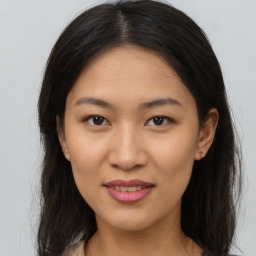 Joyful asian young-adult female with medium  brown hair and brown eyes