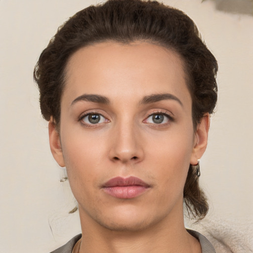 Neutral white young-adult female with short  brown hair and brown eyes