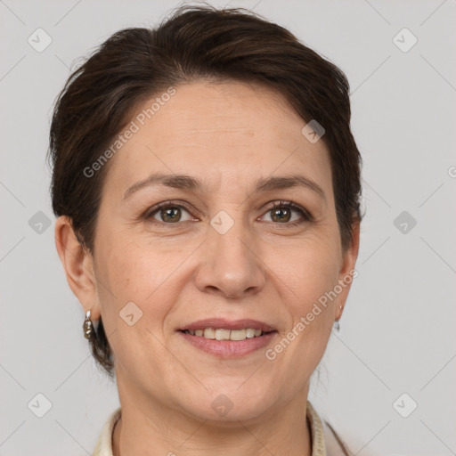 Joyful white adult female with short  brown hair and brown eyes