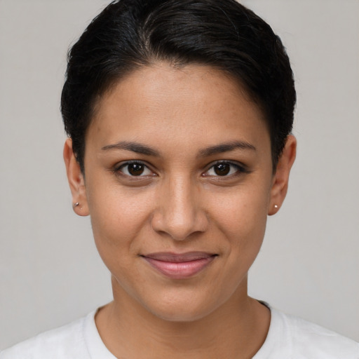 Joyful latino young-adult female with short  brown hair and brown eyes