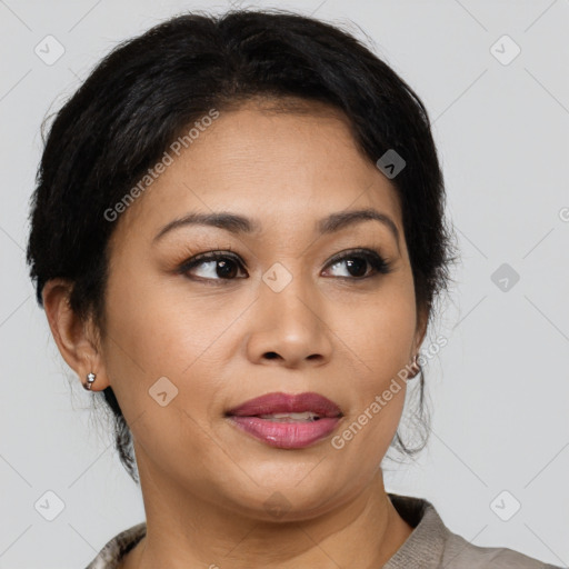 Joyful latino young-adult female with medium  brown hair and brown eyes