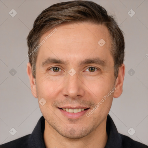 Joyful white adult male with short  brown hair and brown eyes