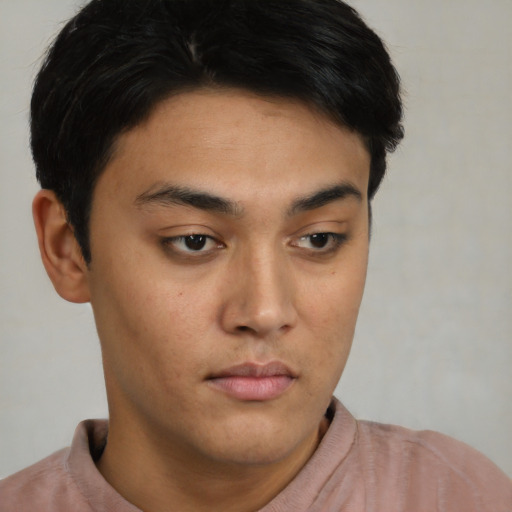 Neutral latino young-adult male with short  brown hair and brown eyes