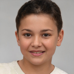 Joyful white child female with short  brown hair and brown eyes