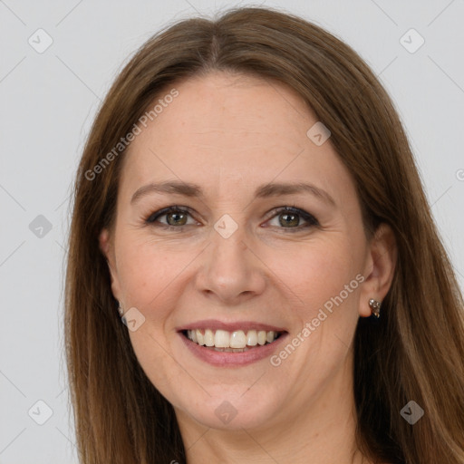 Joyful white adult female with long  brown hair and grey eyes