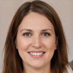 Joyful white young-adult female with medium  brown hair and brown eyes