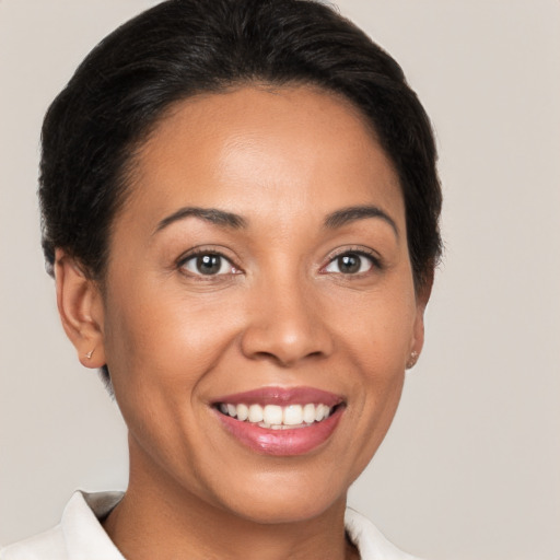 Joyful white young-adult female with short  brown hair and brown eyes