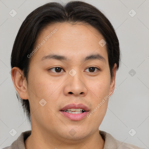 Joyful asian young-adult male with short  brown hair and brown eyes