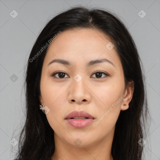 Joyful asian young-adult female with long  brown hair and brown eyes