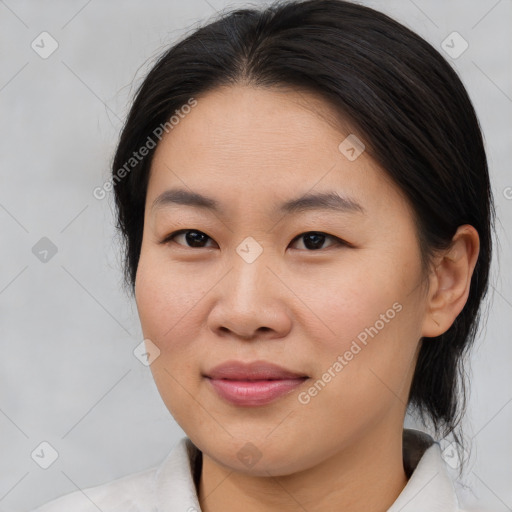 Joyful asian young-adult female with medium  brown hair and brown eyes