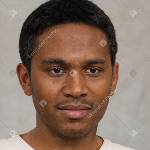 Joyful black young-adult male with short  brown hair and brown eyes