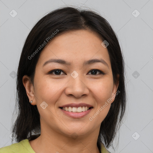 Joyful latino young-adult female with medium  brown hair and brown eyes