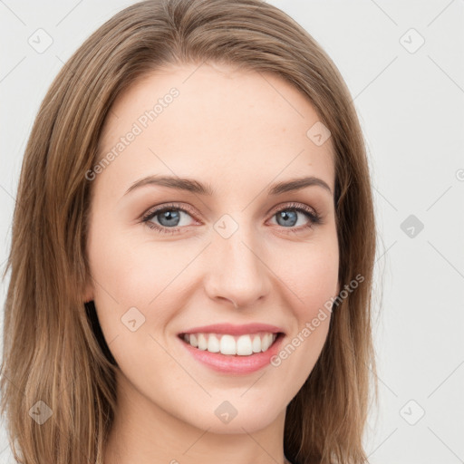 Joyful white young-adult female with long  brown hair and green eyes